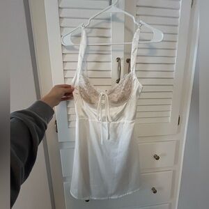 White dress with lace, there nude material under the lace so its not see through